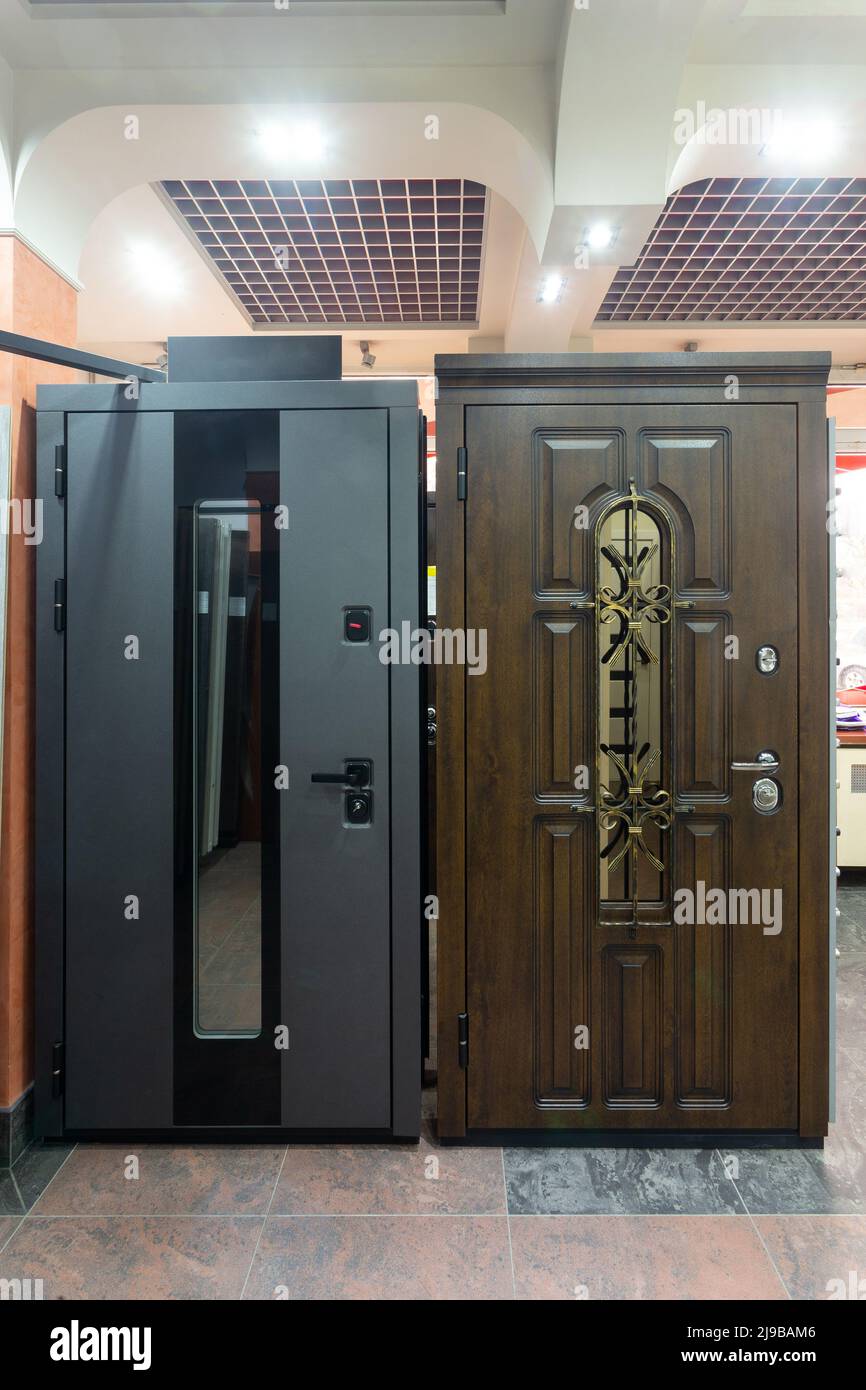 Entrance doors for sale in a specialized store. Buyers prefer metal