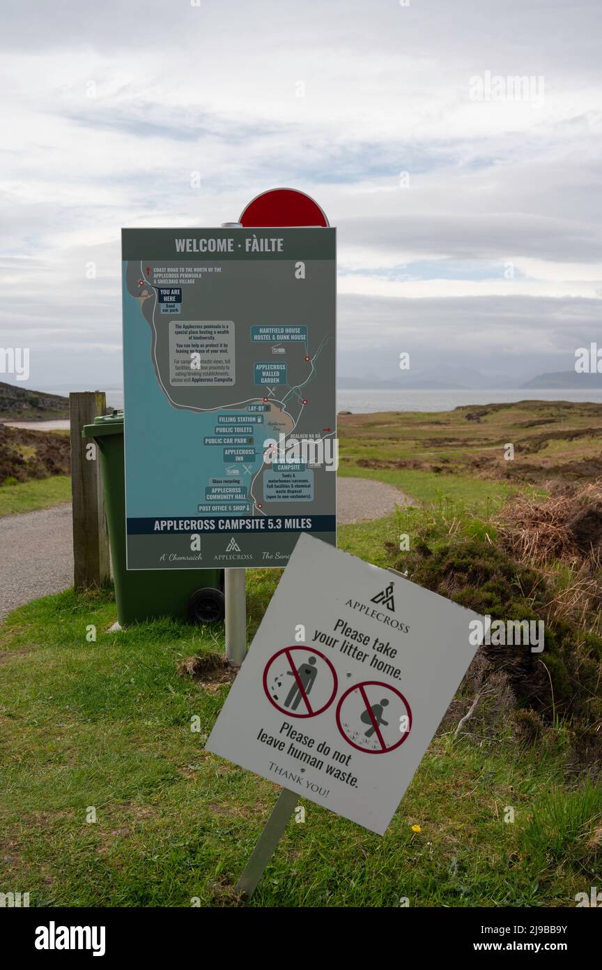 Signage at Sands beach near Applecross on the NC500, Scottish Highlands. Map of area and sign for no littering and no human waste. Blurred background. Stock Photo