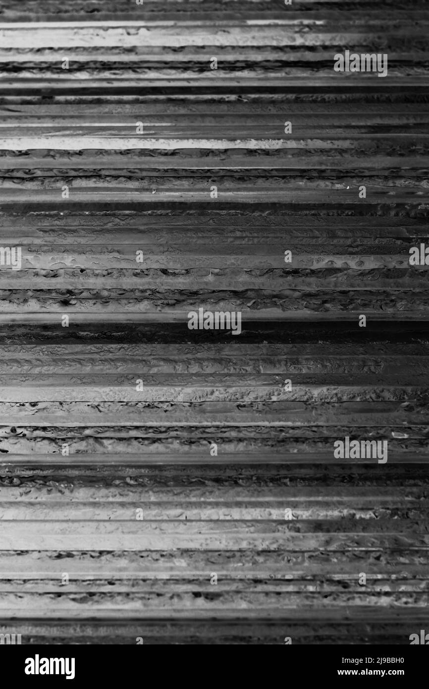 Layers of glass set upon one another as a stack of horizontal plates in