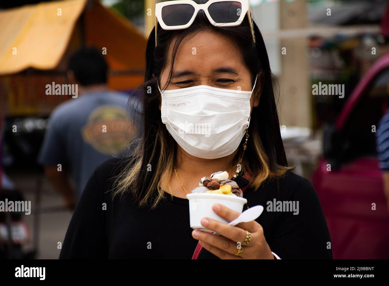 Travelers thai women people travel visit and eating drinking sweet food icecream from food truck