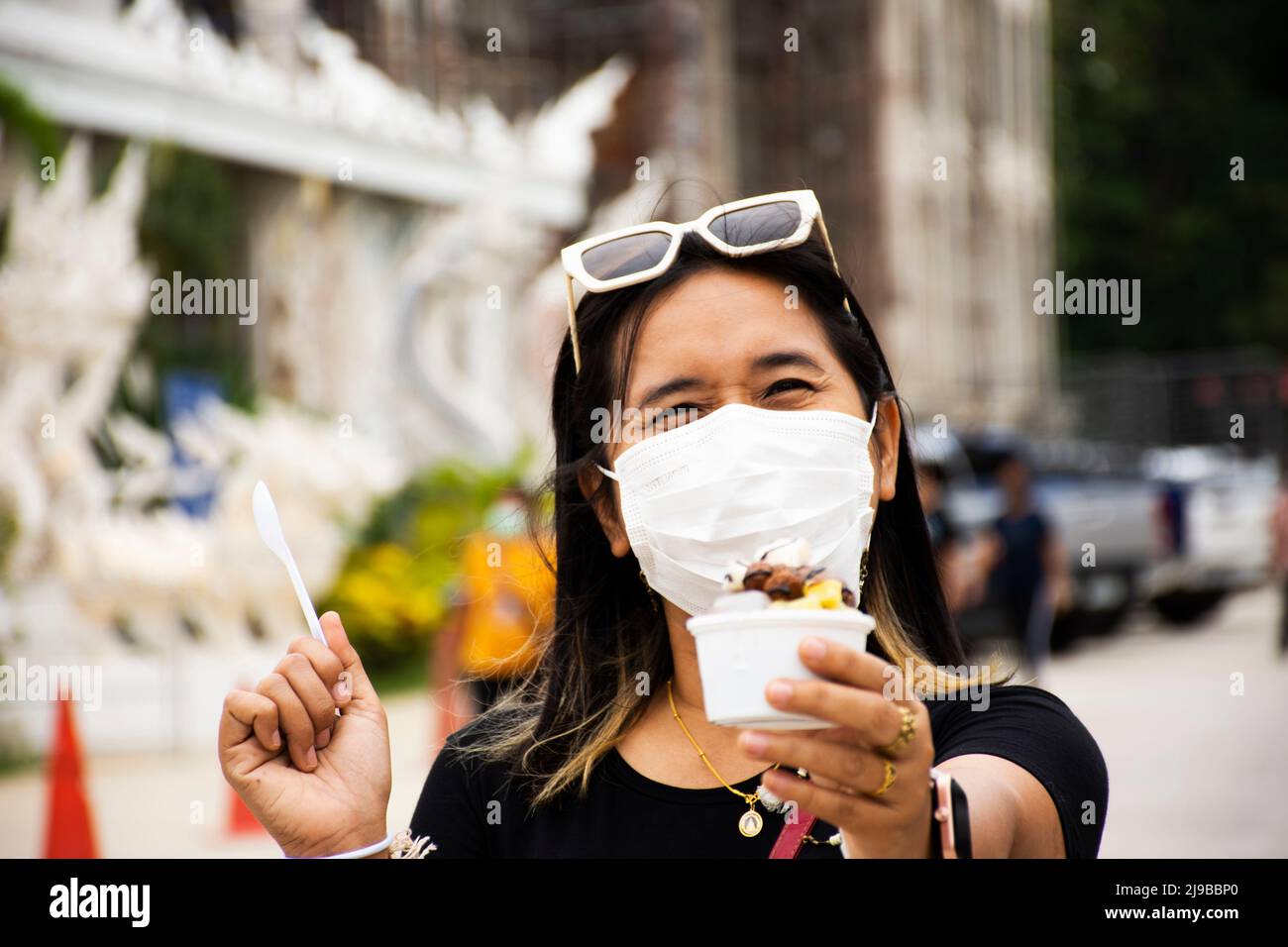 Travelers thai women people travel visit and eating drinking sweet food icecream from food truck