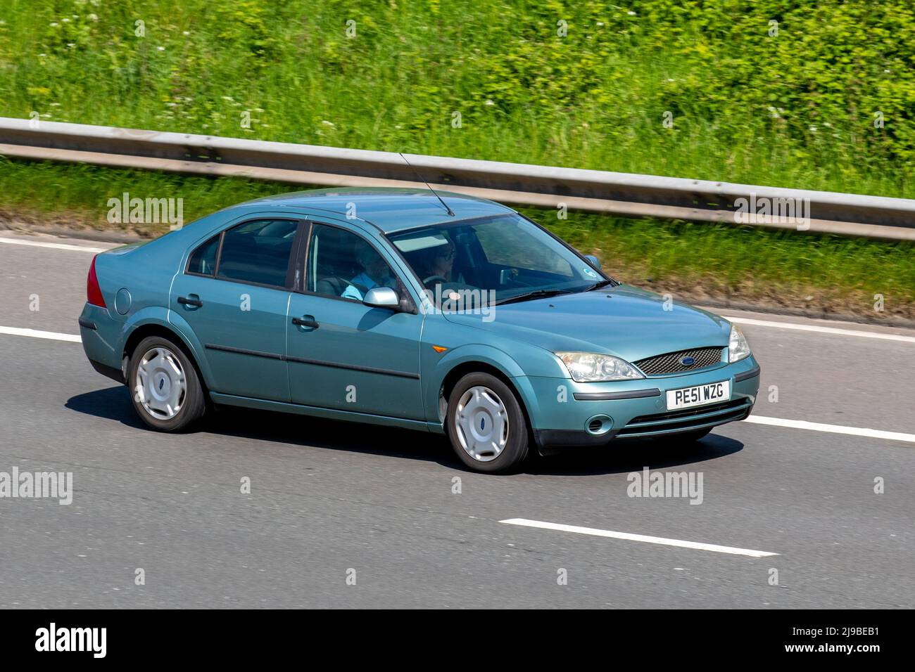 2001 Blue FORD KA NOW 5 speed manual 5dr petrol hatchback; driving on the M6 Motorway, Manchester, UK Stock Photo