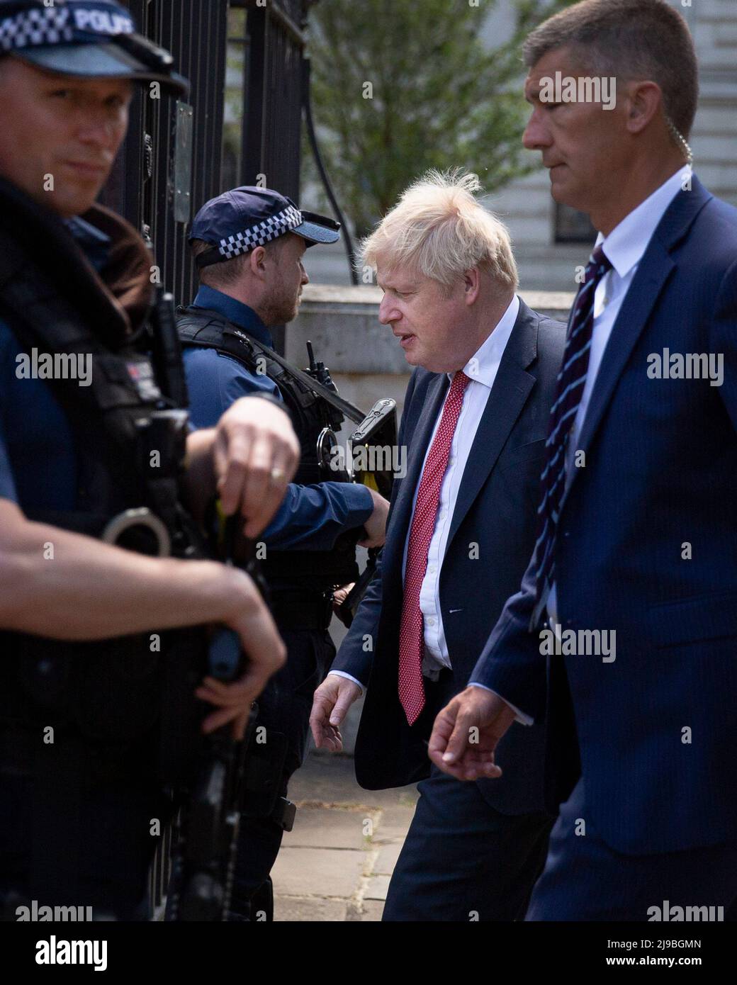 Boris Johnson walks into the back od Downing Street past Police Officers on the day the MET police announce an end to the party gate investigation. Stock Photo