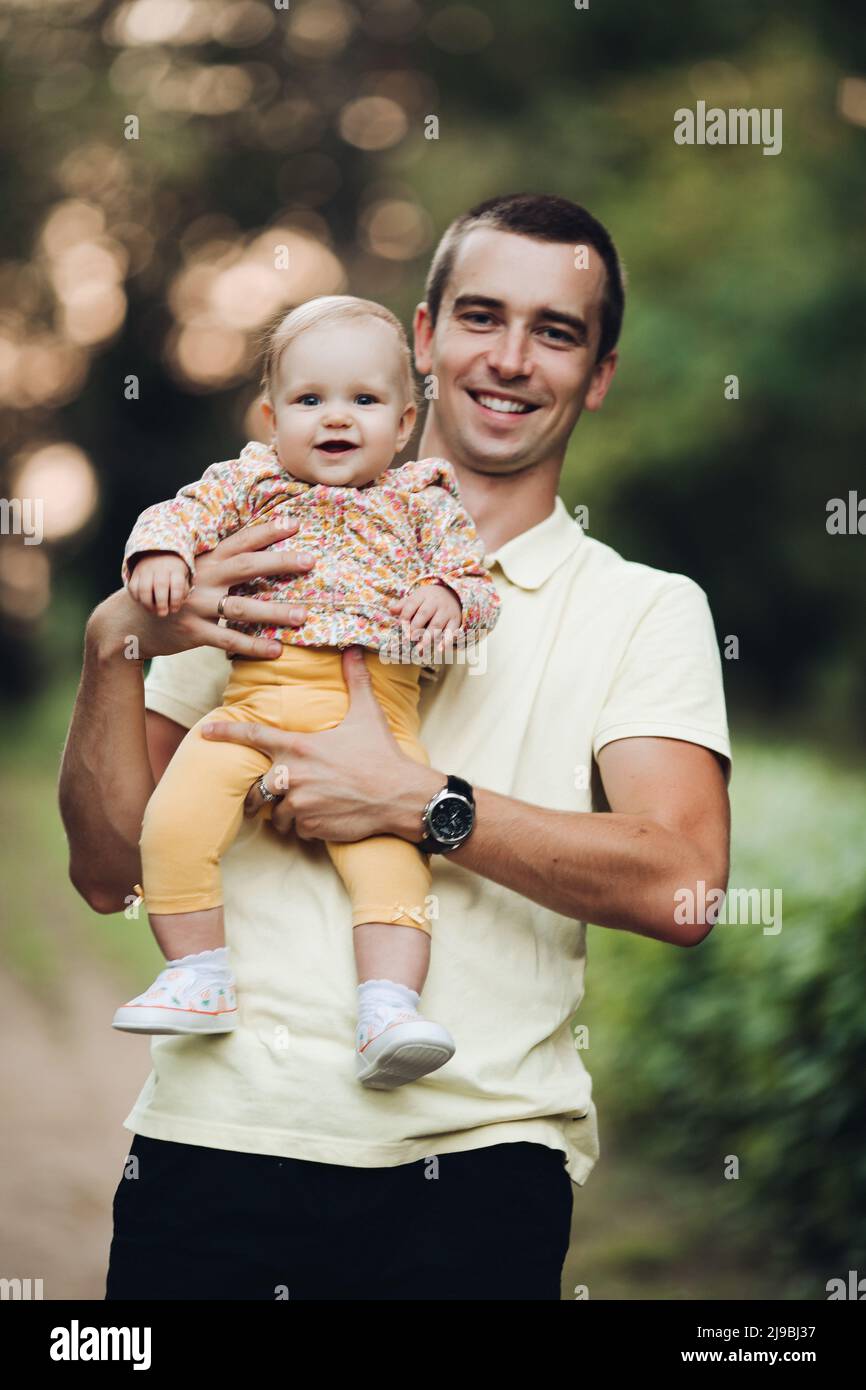 Father and daughter walking in the park in autumn, portrait. Dad and ...