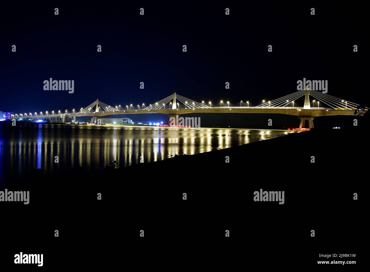 Iconic Payra bridge illuminates at night over River Payra in Bangladesh HD Wallpaper Stock Photo