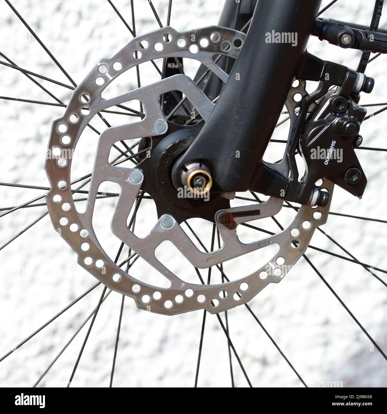 Modern disc brake on front wheel of bicycle Stock Photo Alamy