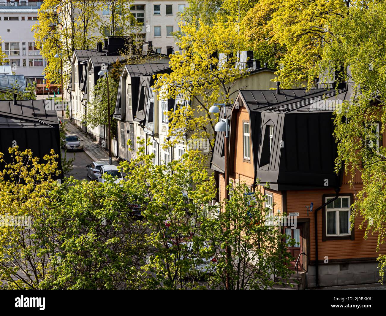 View of Suvannontie and Virtaintie in the Vallila wooden house district of Helsinki, Finland. Stock Photo