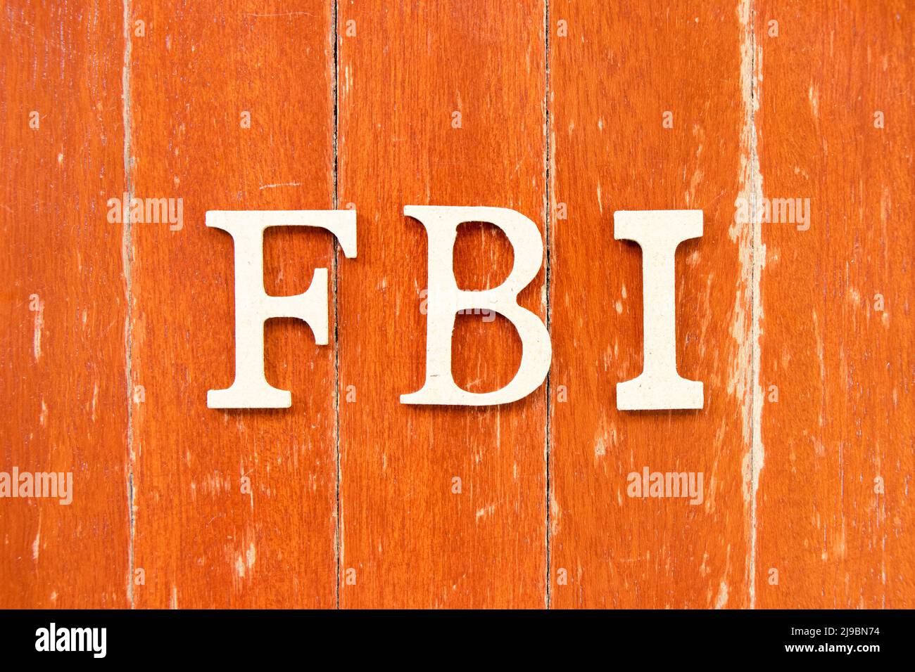 Alphabet letter in word FBI (Abbreviation of Federal Bureau of Investigation)  on old red color wood plate background Stock Photo - Alamy
