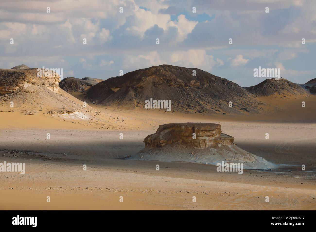 Panoramic View to the Sandy Hills in the Black Desert, is National park in the Farafra Oasis, Egypt Stock Photo