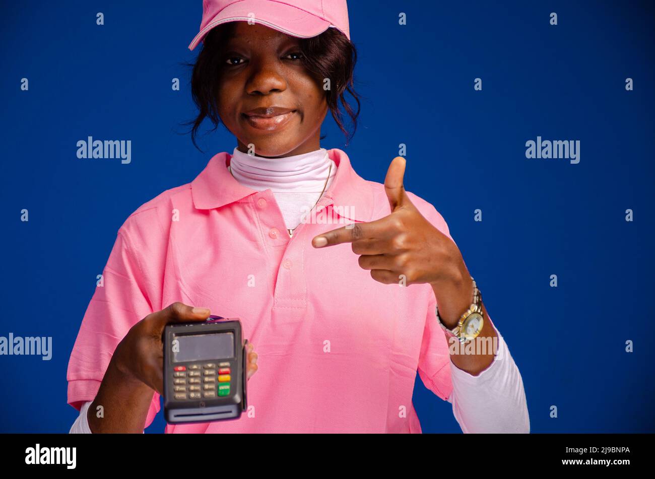 african woman using a point of sale device Stock Photo Alamy