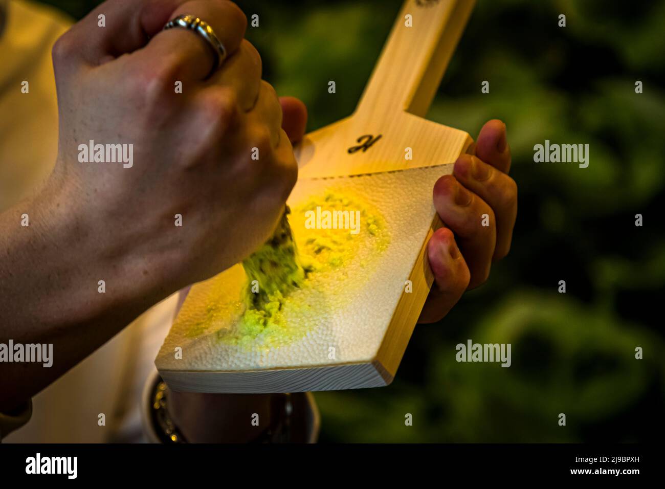 Real wasabi is grated with light pressure in a circular motion on an