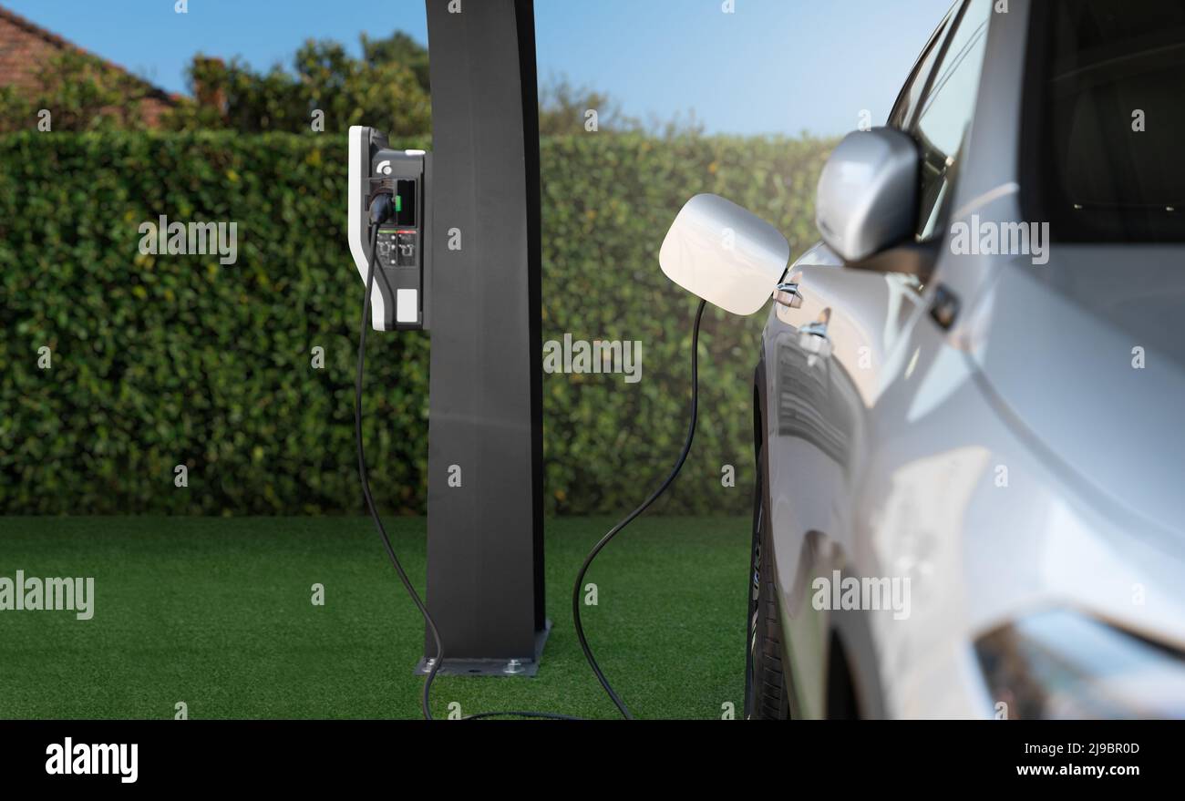 Electric car with a charging station Stock Photo Alamy