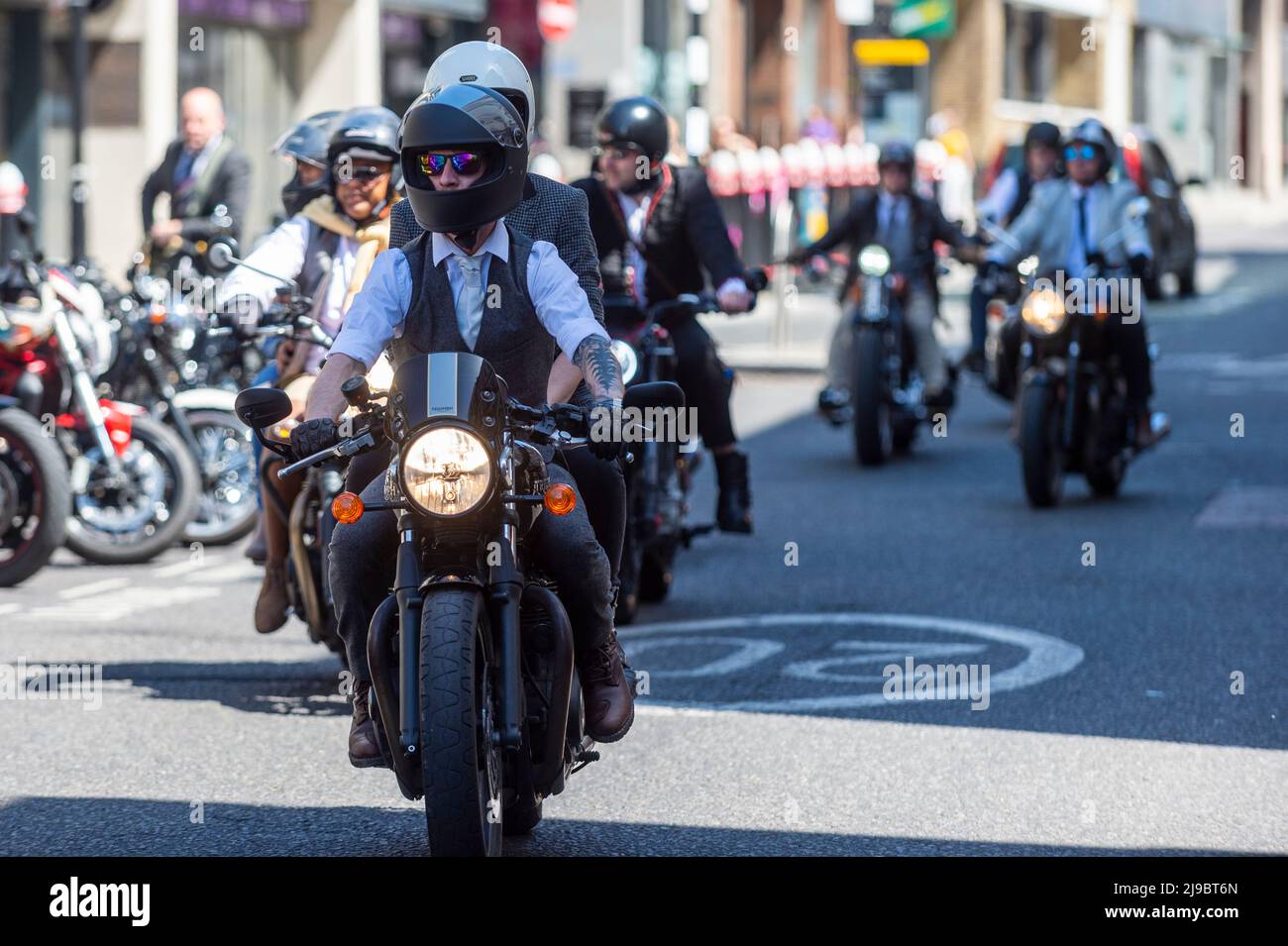 London, UK.  22 May 2022.  Dandily-dressed motorcyclists arrive in Smithfield Market after completing a Distinguished Gentleman’s Ride through central London.  Similar rides are taking place around the world all to raise money and awareness of prostrate cancer and men’s health.  Credit: Stephen Chung / Alamy Live News Stock Photo