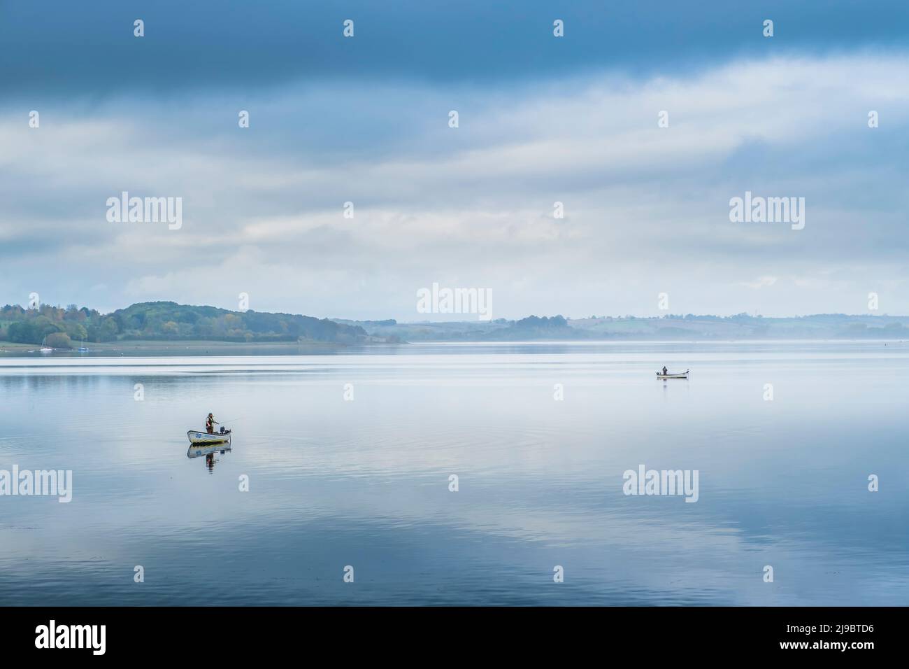 Trout fishing on a calm day at Rutland Water. Stock Photo