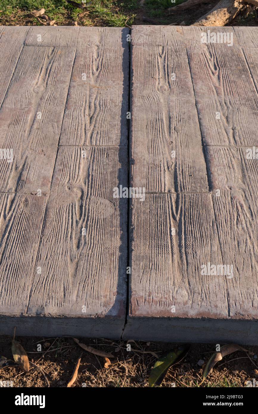 Separation and breakage between pavement sections. Expansion joint working at stamped concrete