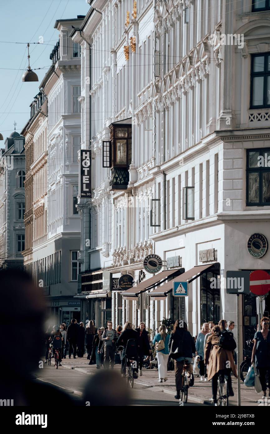 Tourists and local citizens stroll through the central pedestrian area of the Danish capital of Copenhagen Stock Photo