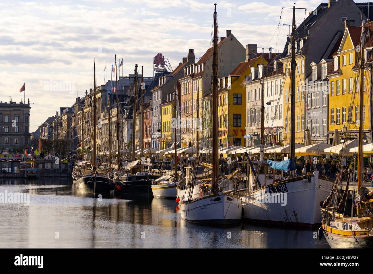 Nyhavn district is one of the most famous landmark in Copenhagen in a summer day Stock Photo