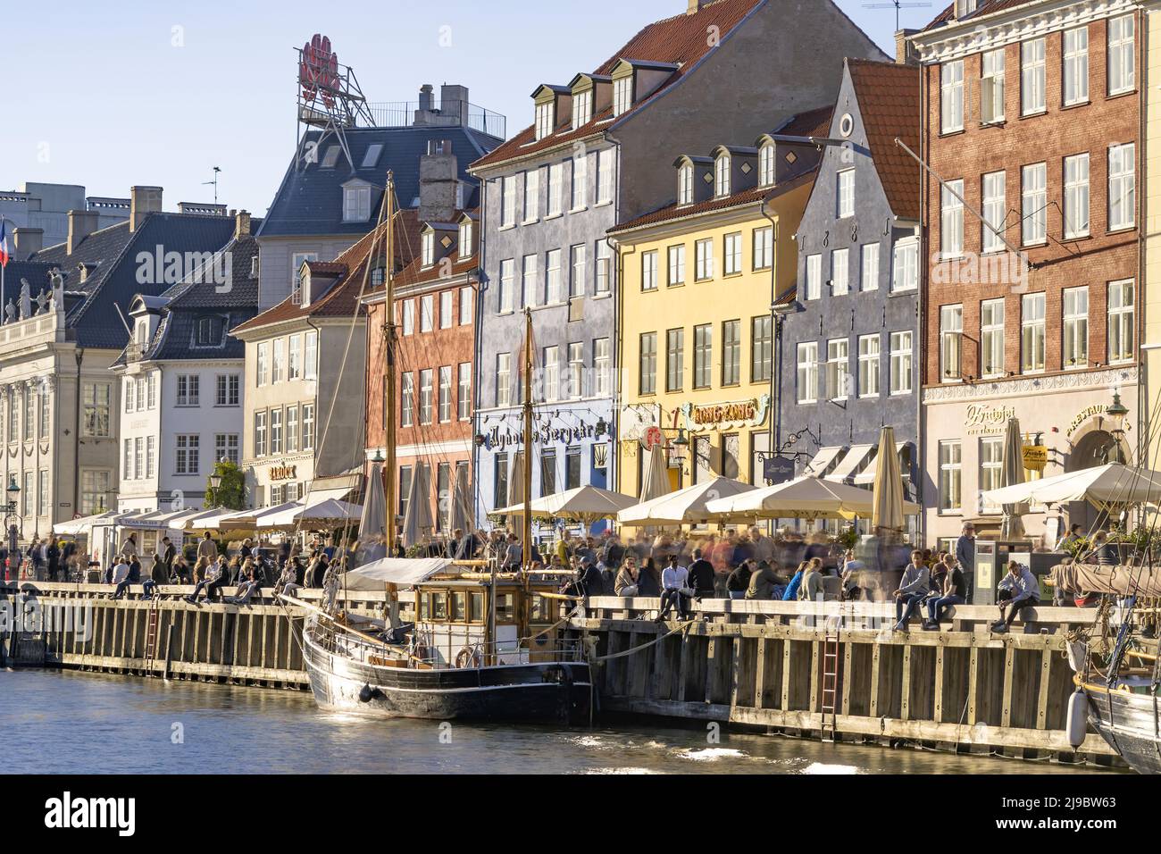 Nyhavn district is one of the most famous landmark in Copenhagen in a summer day Stock Photo