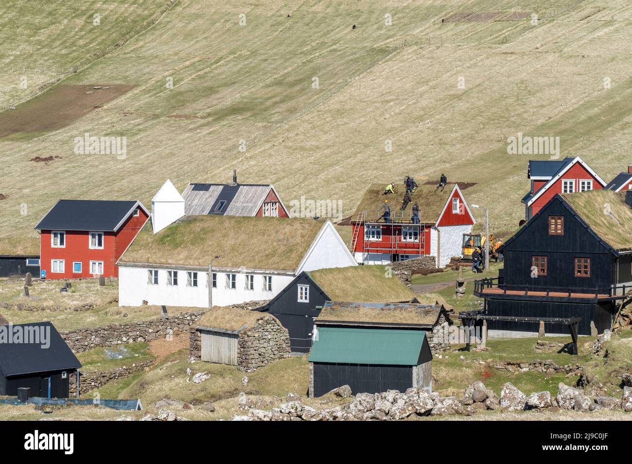 The roofers being lazy on a sunny day in Mykines. Stock Photo