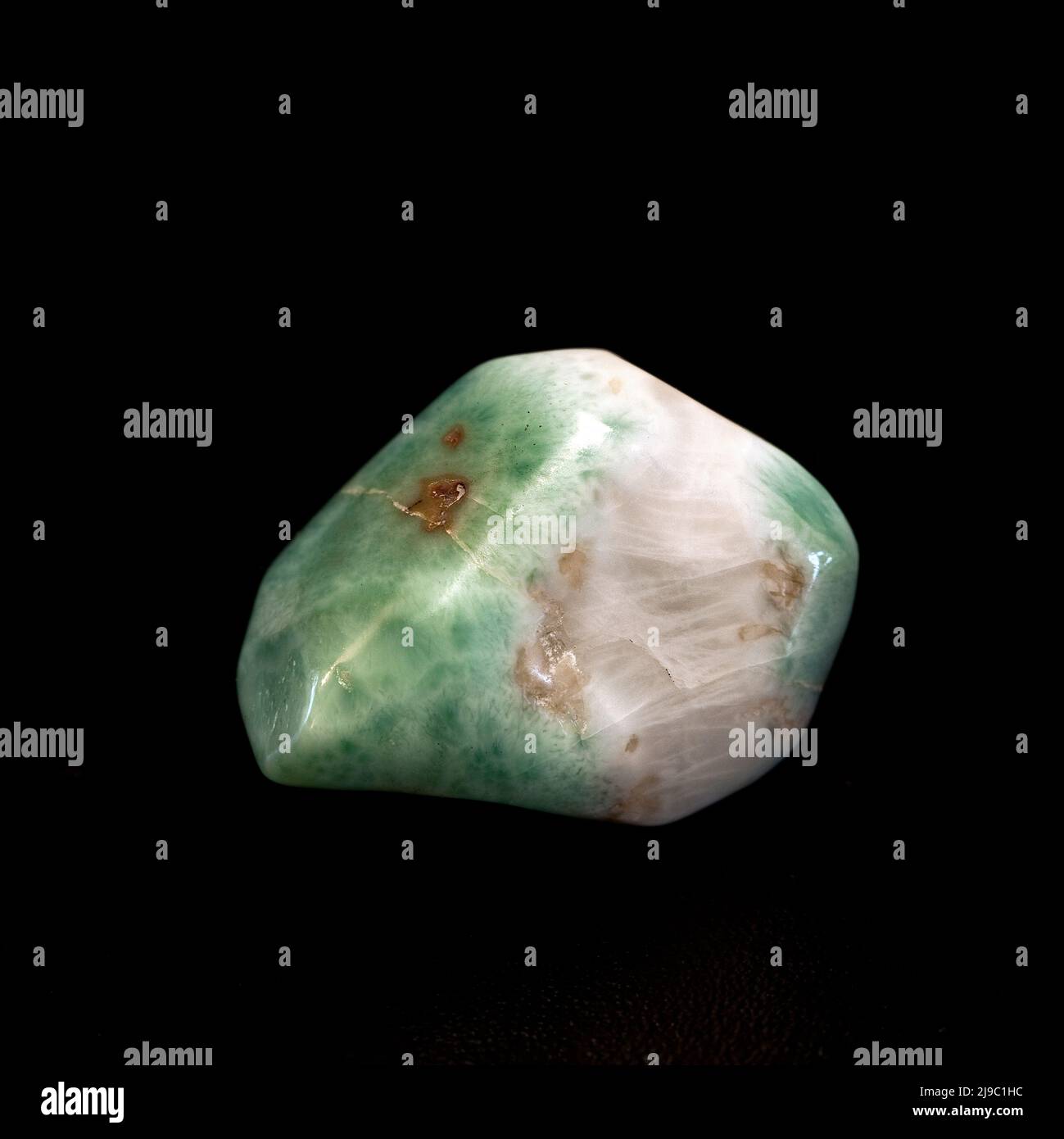 Macro close up colour photograph of a polished 'Larimar' a semi precious crystal gemstone used in crystal healing therapy Stock Photo