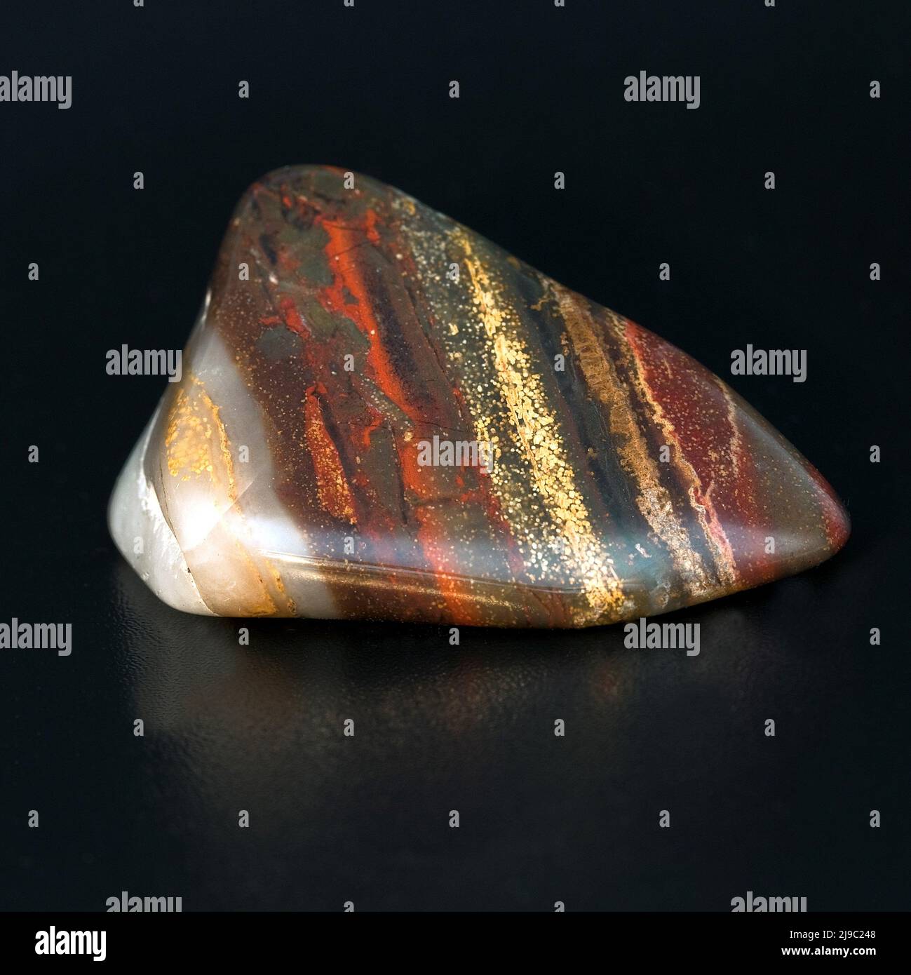 Macro close up colour photograph of 'Rainbow Jasper' a semi precious