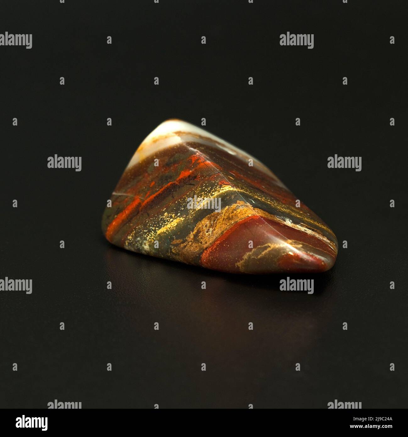 Macro close up colour photograph of 'Rainbow Jasper' a semi precious