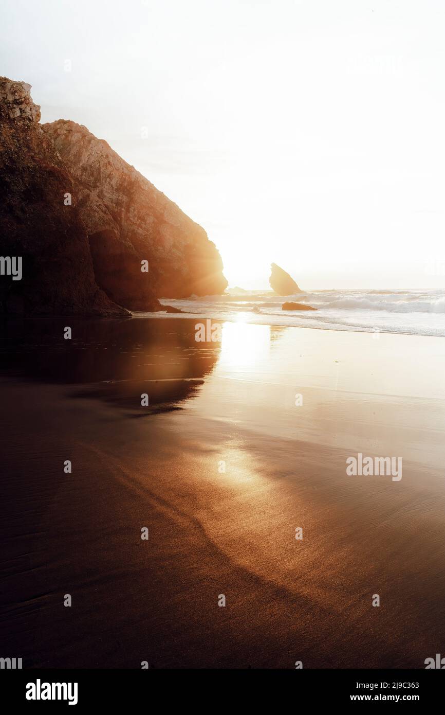 Sunset light reflection on sea sand surface Stock Photo