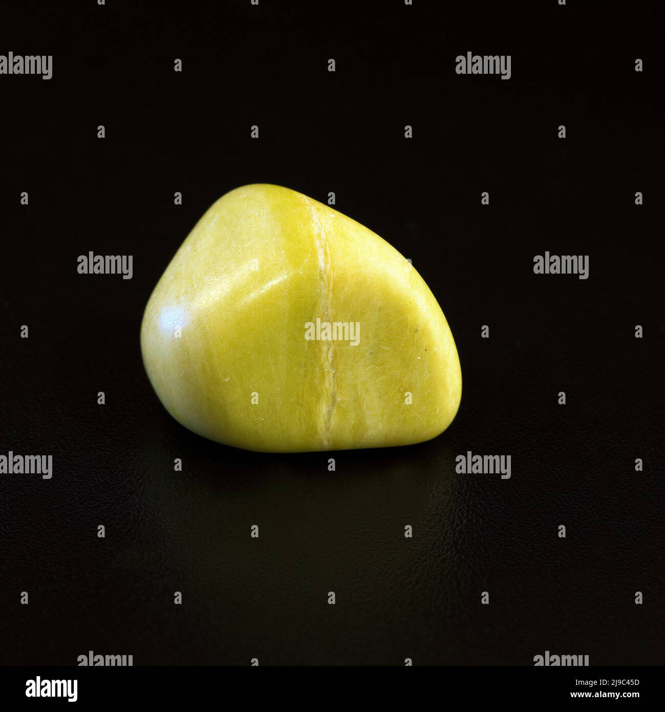 Macro close up colour photograph of 'Yellow Serpentine' a semi precious