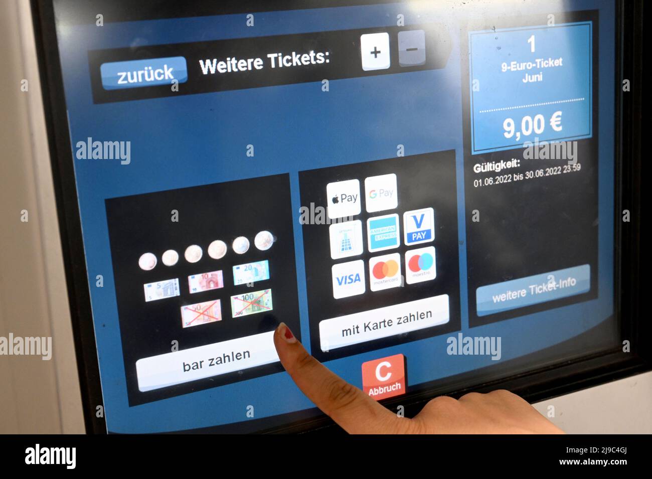 22 May 2022, Bavaria, Munich: A traveler buys a 9-euro ticket from a ticket  vending machine at the Theresienstrasse subway station. The German  government presented an energy relief package at the end
