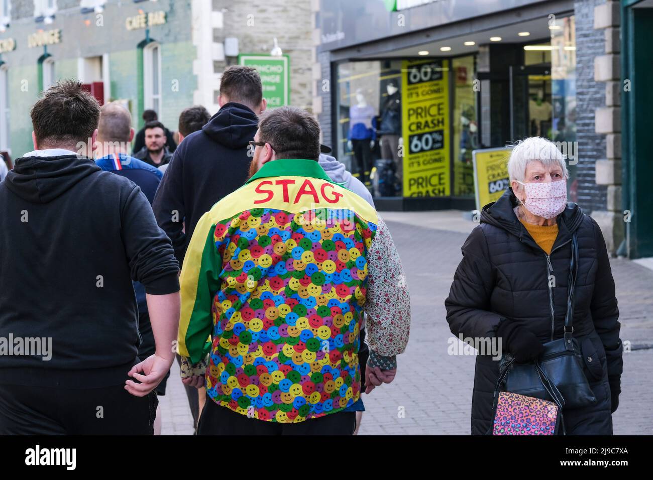 A group of lads on a stag weekend walking through Newquay Town centre in Cornwall. Stock Photo