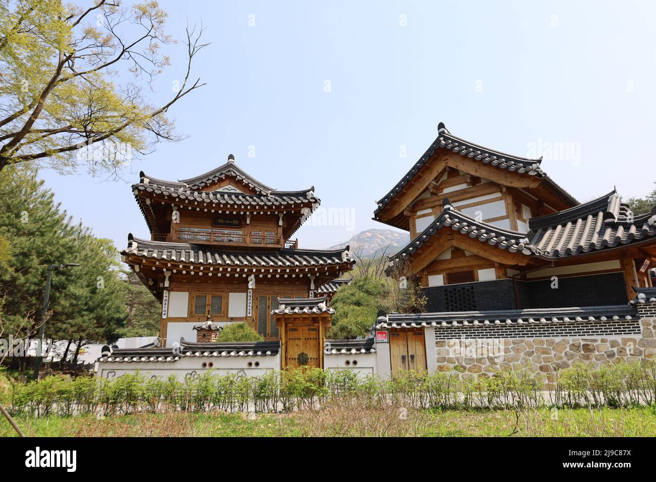 A few buildings next to a park in the modern traditional Eunpyong Hanuk Village, South Korea Stock Photo