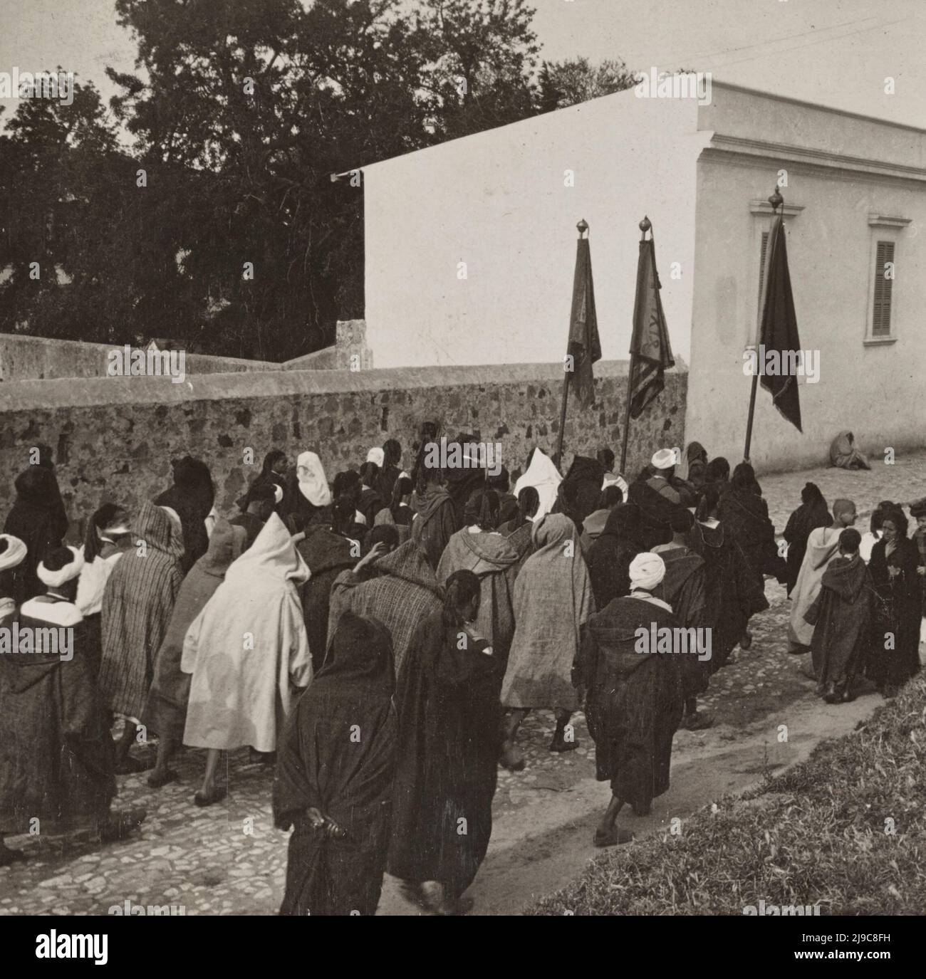 Moorish procession escorting a returned pilgrim from Mecca into Tangier, Morocco, 1908 Stock Photo