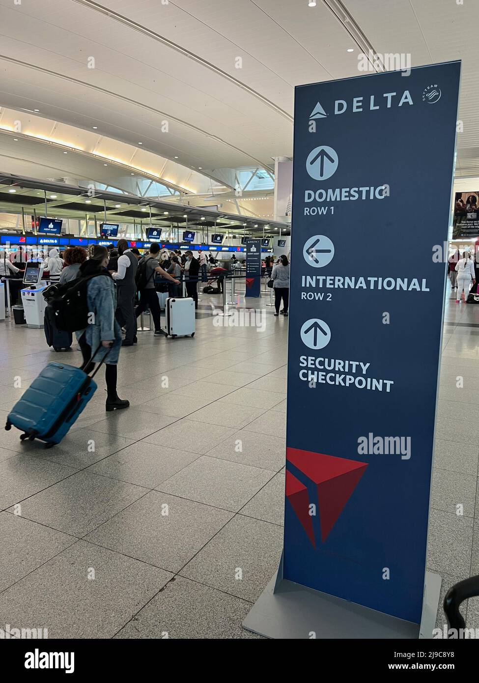 Passengers walk through Terminal 4 at JFK Airport in New York on May 20