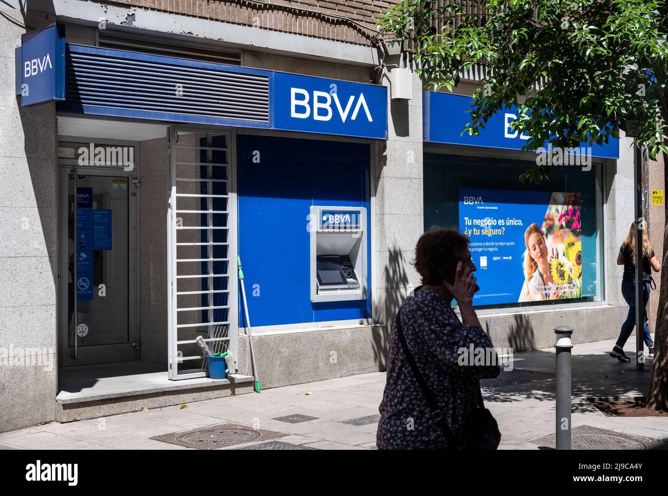 Pedestrians walk past the Spanish multinational Banco Bilbao Vizcaya Argentaria SA (BBVA) bank in Spain. (Photo by Xavi Lopez / SOPA Images/Sipa USA) Stock Photo