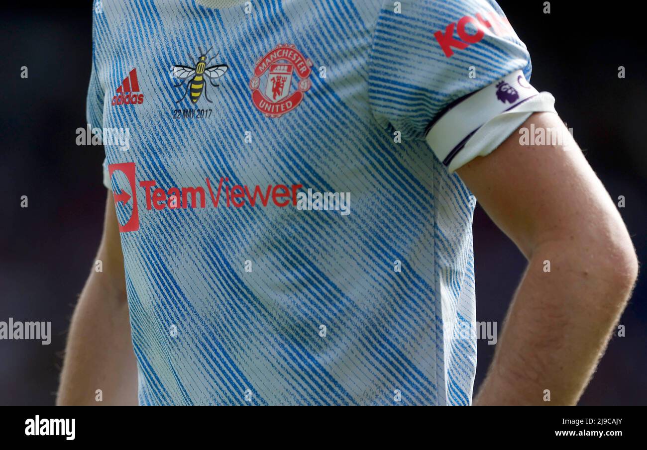 A close up of the Worker Bee symbol, in memory of the fifth anniversary of the bombing attack at Manchester Arena during an Ariana Grande concert, on Manchester United's Harry Maguire's shirt during the Premier League match at Selhurst Park, London. Picture date: Sunday May 22, 2022. Stock Photo