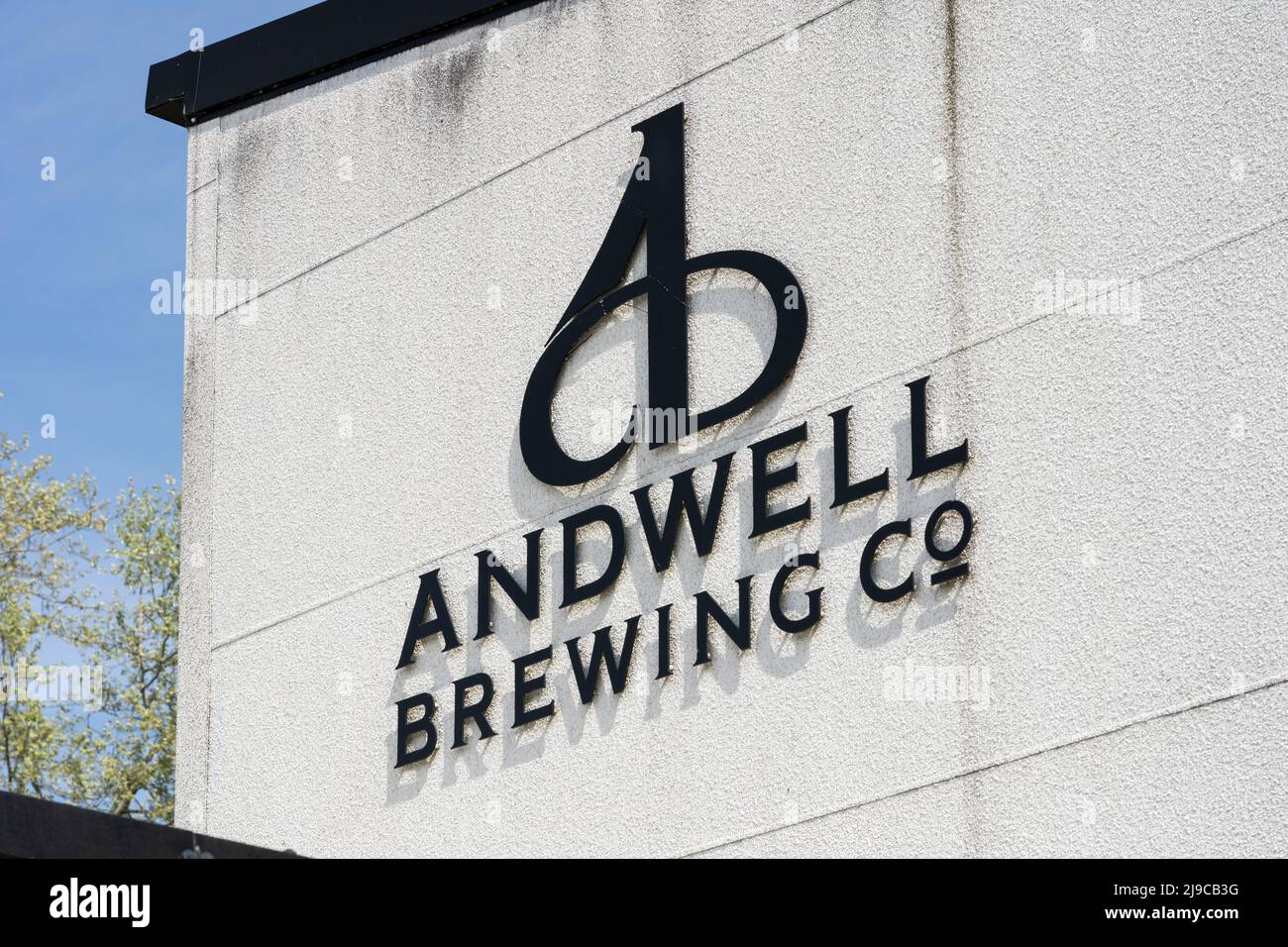 Closeup on the logo and name for the Andwell Brewing Company on the side of the brewery building near Hook in Hampshire, England Stock Photo