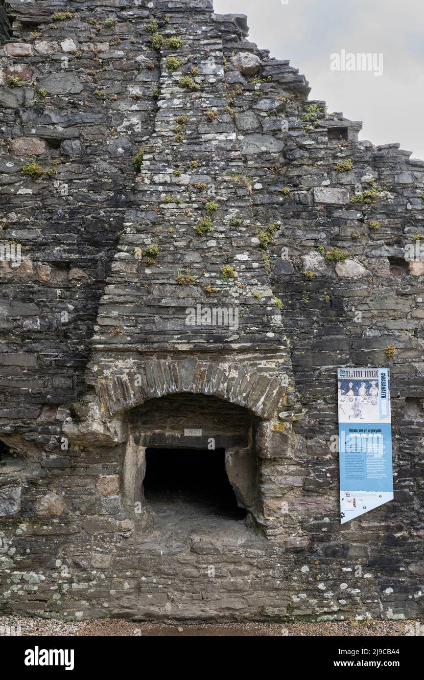 The ruined remains of Kidwelly Castle bakehouse and oven in the outer ward. Carmarthen, Wales, UK Stock Photo