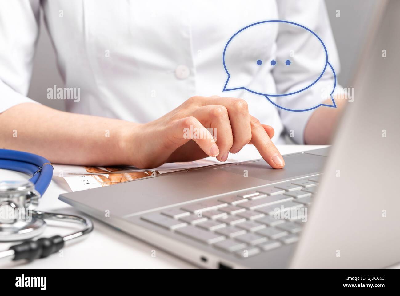 Medical online consultation. Doctor chatting, typing answers to patient about health concerns. Remote diagnostics and treatment concept. Using remote computer technologies in clinic. photo Stock Photo
