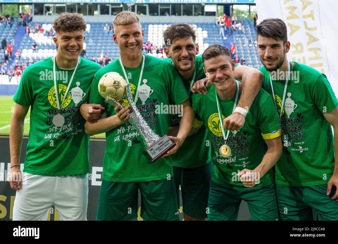 sports, football, Lower Rhine Cup 2021/2022, final, SV Straelen vs. Wuppertaler SV 1-0, Schauinsland-Reisen-Arena in Duisburg, award ceremony, prize cup to the cup winner SV Straelen, v.l.n.r. Kelvin Lunga (Str), goal keeper Robin Udegbe (Str), Matona Glody Ngyombo (Str) Stock Photo