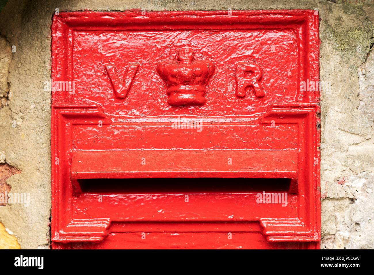 Victorian letterbox at Burdon in Sunderland, England. The red post box dates from the 19th century and the reign of Queen Victoria. Stock Photo
