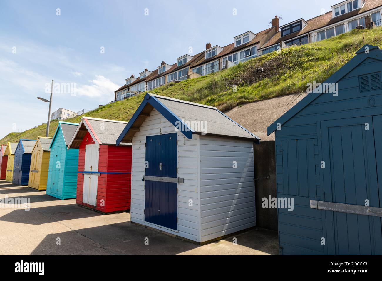 Beach huts on the beach in Sheringham, North Norfolk, UK Stock Photo