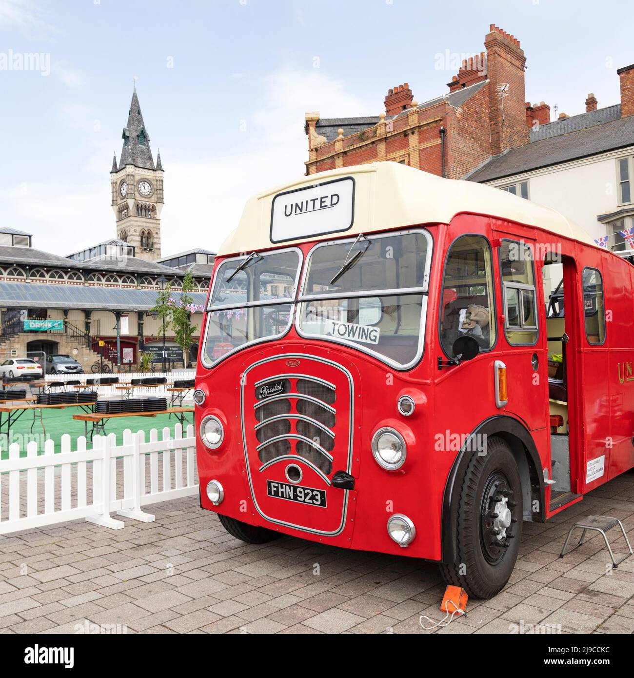 Vintage vehicle on the Horse Market in Darlington, County Durham, England. The clock tower of Darlington Covered Market can be seen left of the pictur Stock Photo