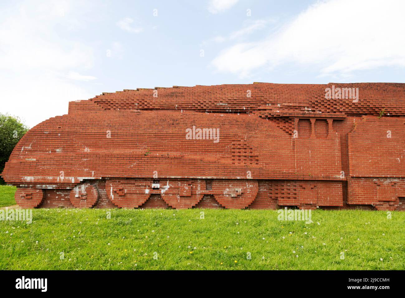 Darlington Brick Train in Darlington, County Durham, England. The brickwork sculpture, depicting a speeding Mallard locomotive, was created by David M Stock Photo