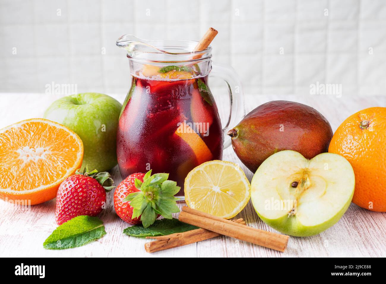 Jar with sangria, a typical Spanish drink, along with the fruits used