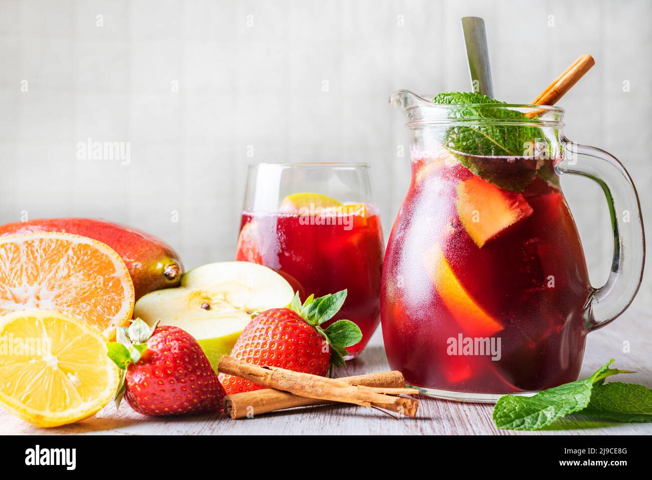 Pitcher and glass with sangria, a typical Spanish drink, along with the