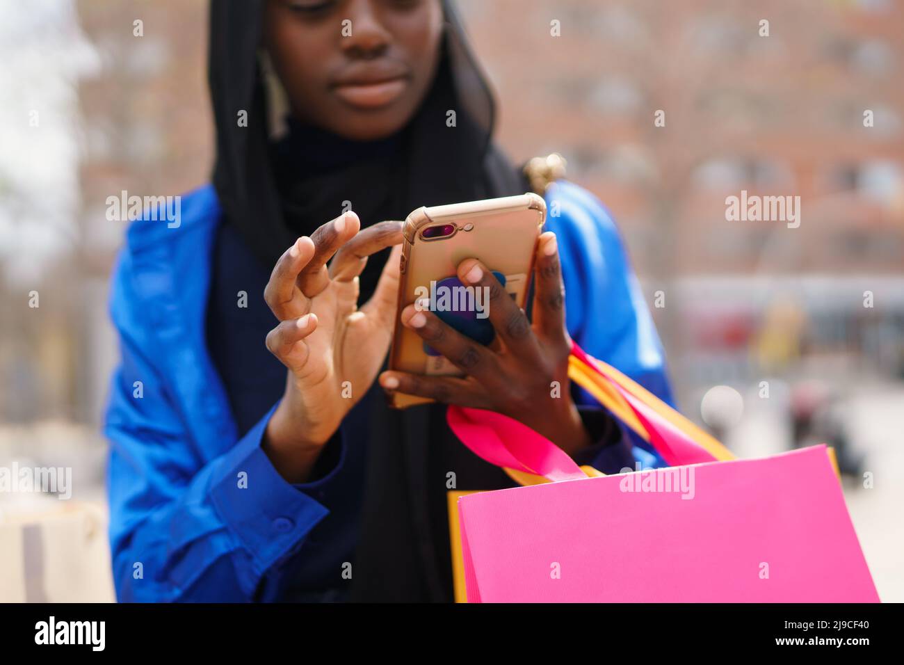 Crop black shopper browsing social media Stock Photo