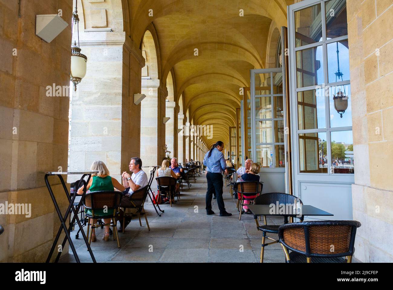 Bordeaux, France,  Medium Group People Sharing Drinks Outside, Old French Cafe Terrace, French Waiter Stock Photo