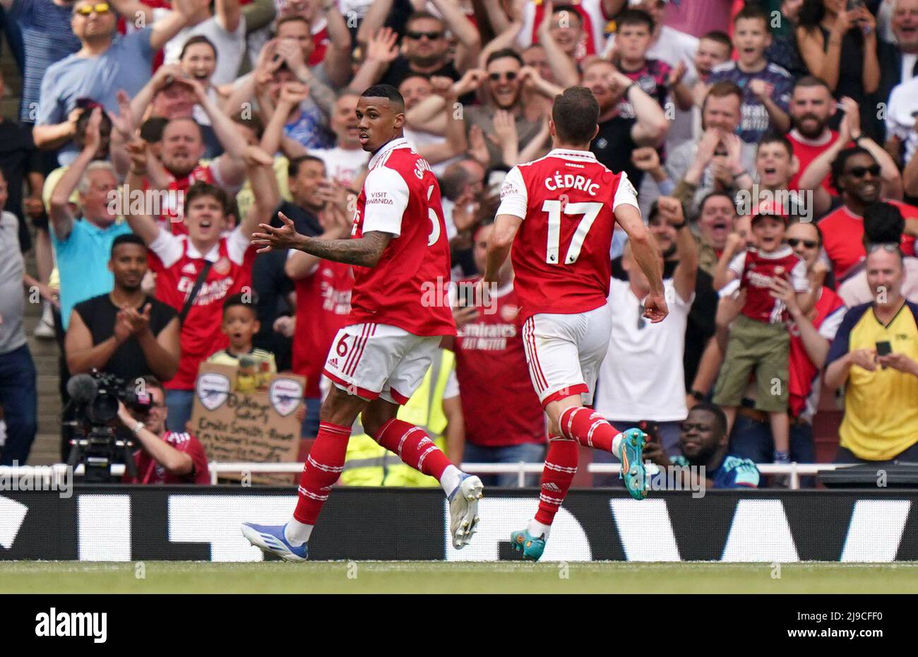 Arsenal's Gabriel Magalhaes (left) celebrates scoring their side's ...