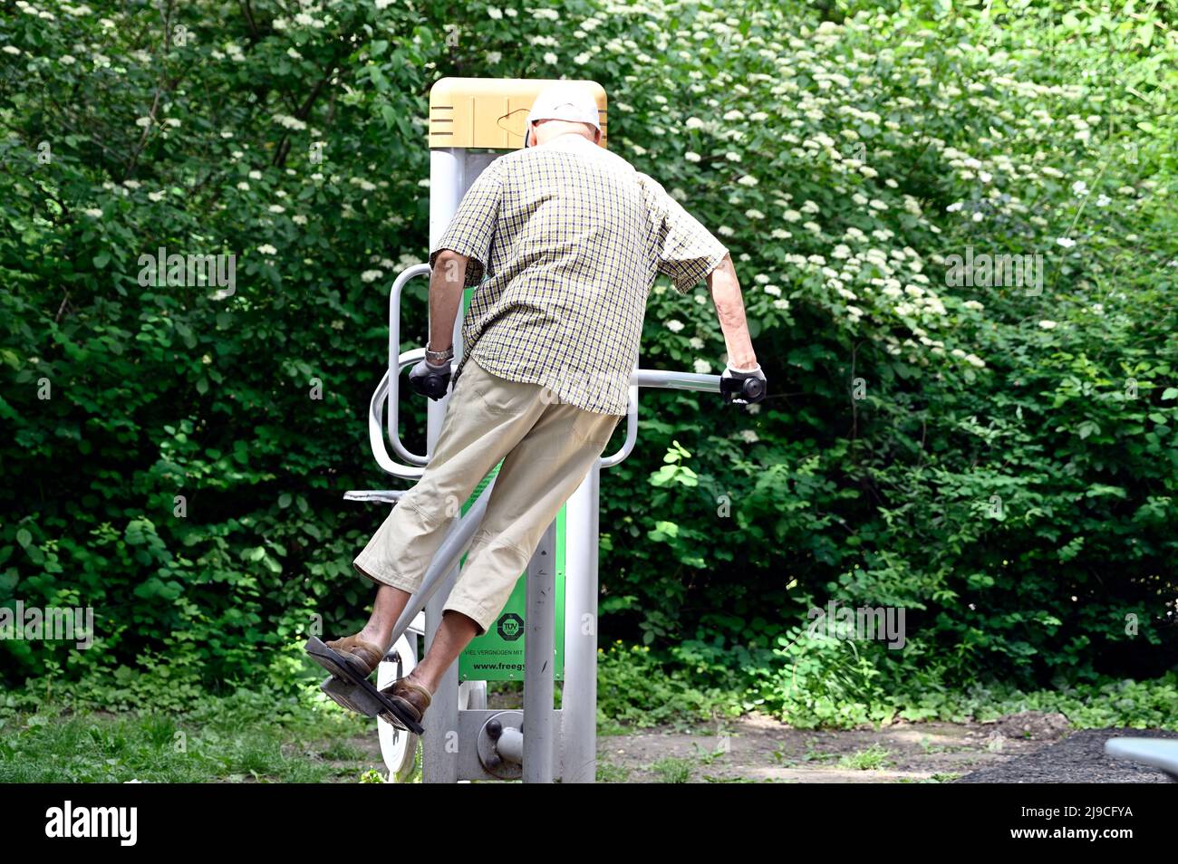 Vienna, Austria. Man on fitness equipment in the park Stock Photo