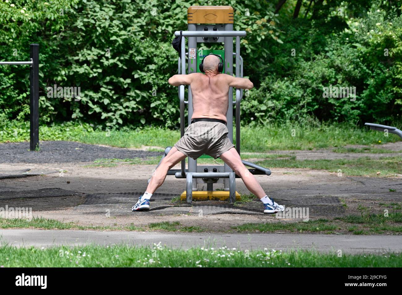 Vienna, Austria. Man on fitness equipment in the park Stock Photo